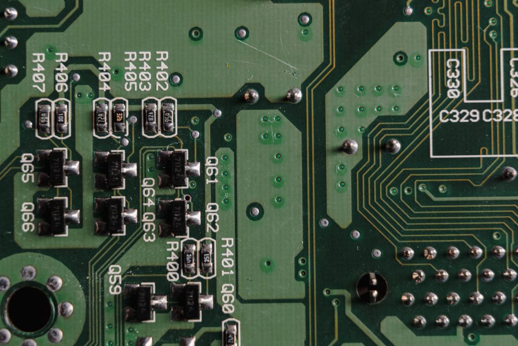 System board with soldered holes